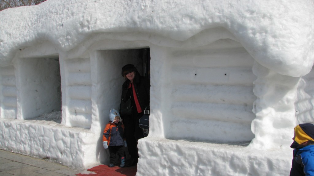 My mother and Bub 1 coming out of a Snow House  in Harbin