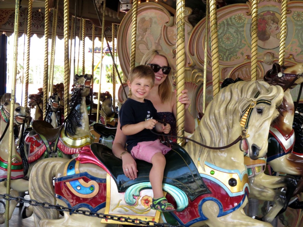 Bub 2 very happy to be riding the carousel with his aunty Sisi.