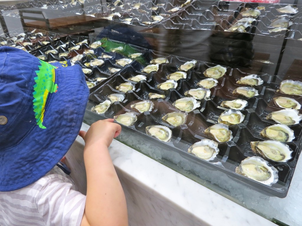 Bub 2 was not enticed to try any of the oysters at the Sydney Fish Markets but he enjoyed looking.