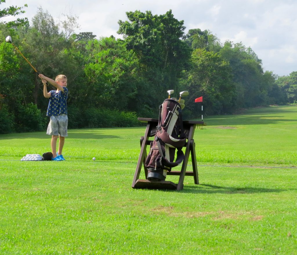 Trying out the driving range at the Pan Pacific Nirwana Bali